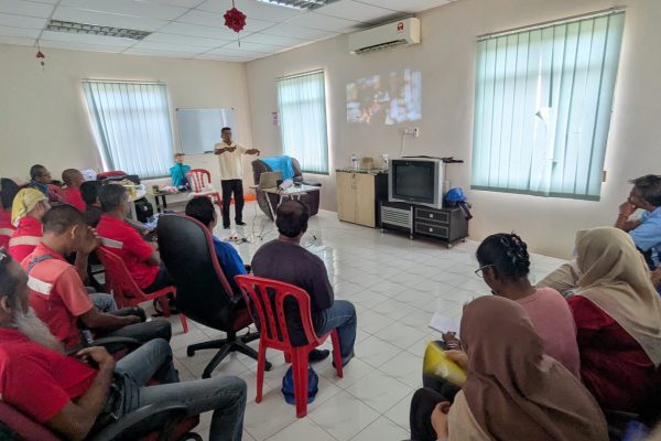 Basic Occupational First Aid Course hands-on CPR training AED demonstration during First Aid Course Malaysia Workplace safety first aid wound care session