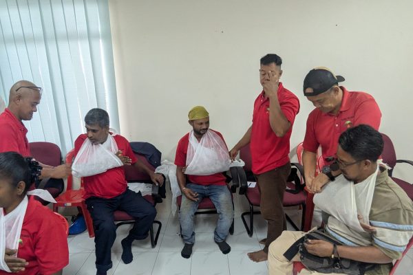 Basic Occupational First Aid Course hands-on CPR training AED demonstration during First Aid Course Malaysia Workplace safety first aid wound care session