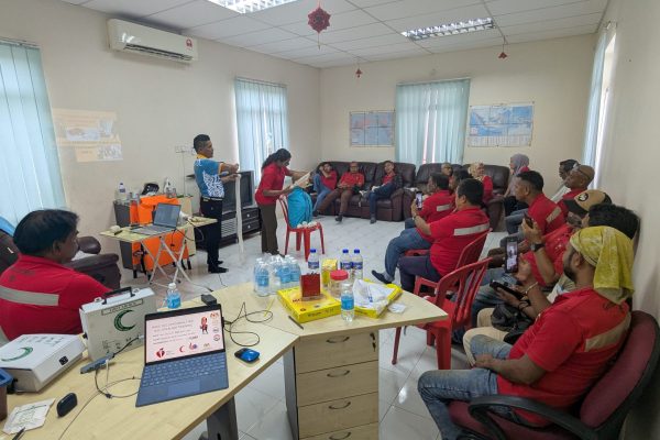 Basic Occupational First Aid Course hands-on CPR training AED demonstration during First Aid Course Malaysia Workplace safety first aid wound care session