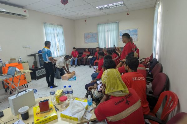 Basic Occupational First Aid Course hands-on CPR training AED demonstration during First Aid Course Malaysia Workplace safety first aid wound care session