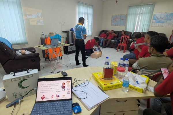 Basic Occupational First Aid Course hands-on CPR training AED demonstration during First Aid Course Malaysia Workplace safety first aid wound care session