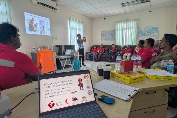 Basic Occupational First Aid Course hands-on CPR training AED demonstration during First Aid Course Malaysia Workplace safety first aid wound care session