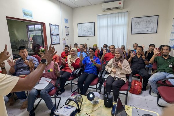 Basic Occupational First Aid Course hands-on CPR training AED demonstration during First Aid Course Malaysia Workplace safety first aid wound care session