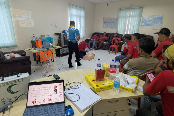 Basic Occupational First Aid Course hands-on CPR training AED demonstration during First Aid Course Malaysia Workplace safety first aid wound care session